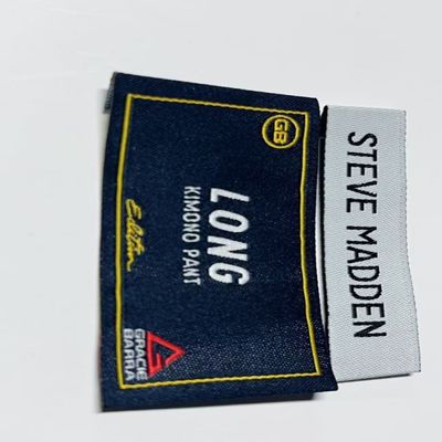 Etichette di abbigliamento con taglio ad ultrasuoni ricamati