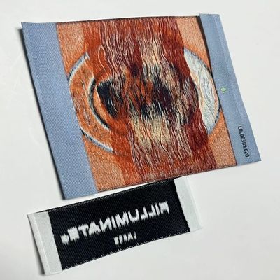 Etichette di abbigliamento a sfera con taglio ad ultrasuoni
